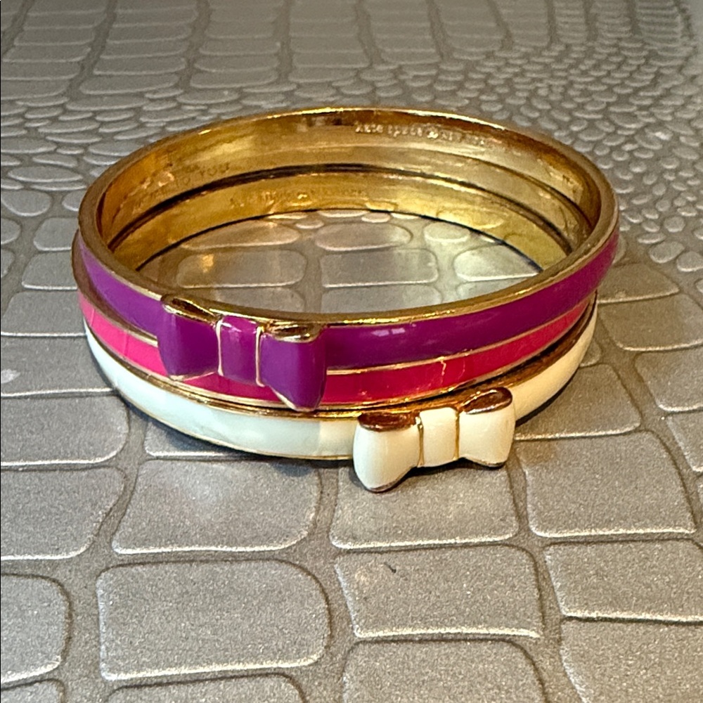 Set of three kate spade Gold, Purple, and Cream Bow Bangle Bracelets